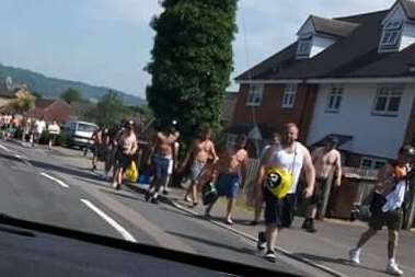 A crowd of people on their way to the blue lake at Halling