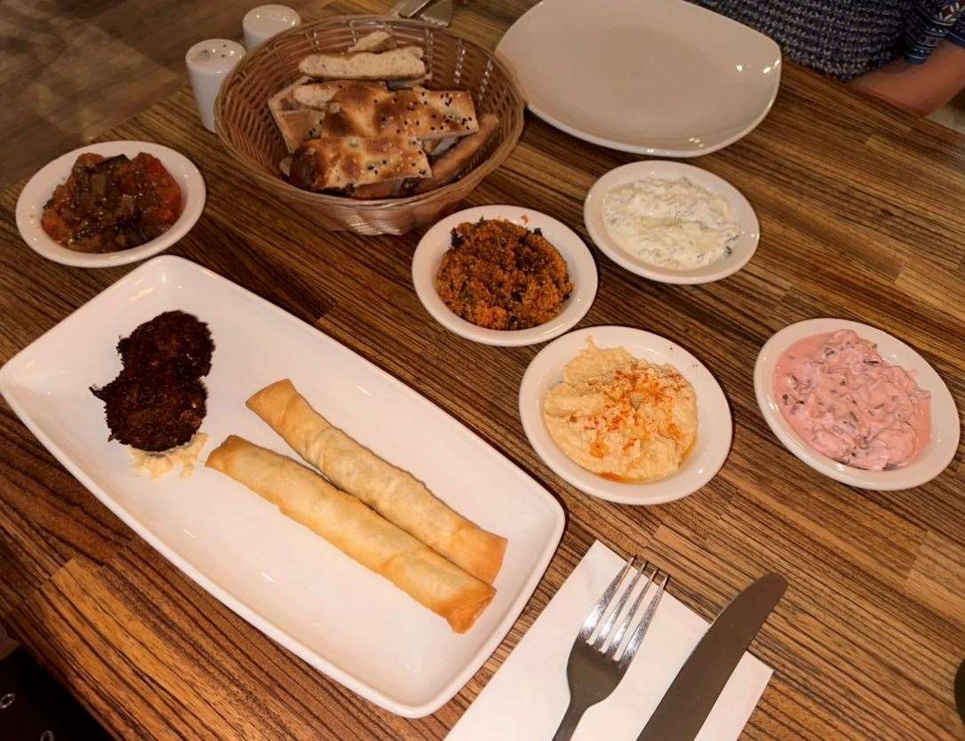 The mixed mezze first course included hummus, falafel, cous cous and an array of small plates served with hot bread