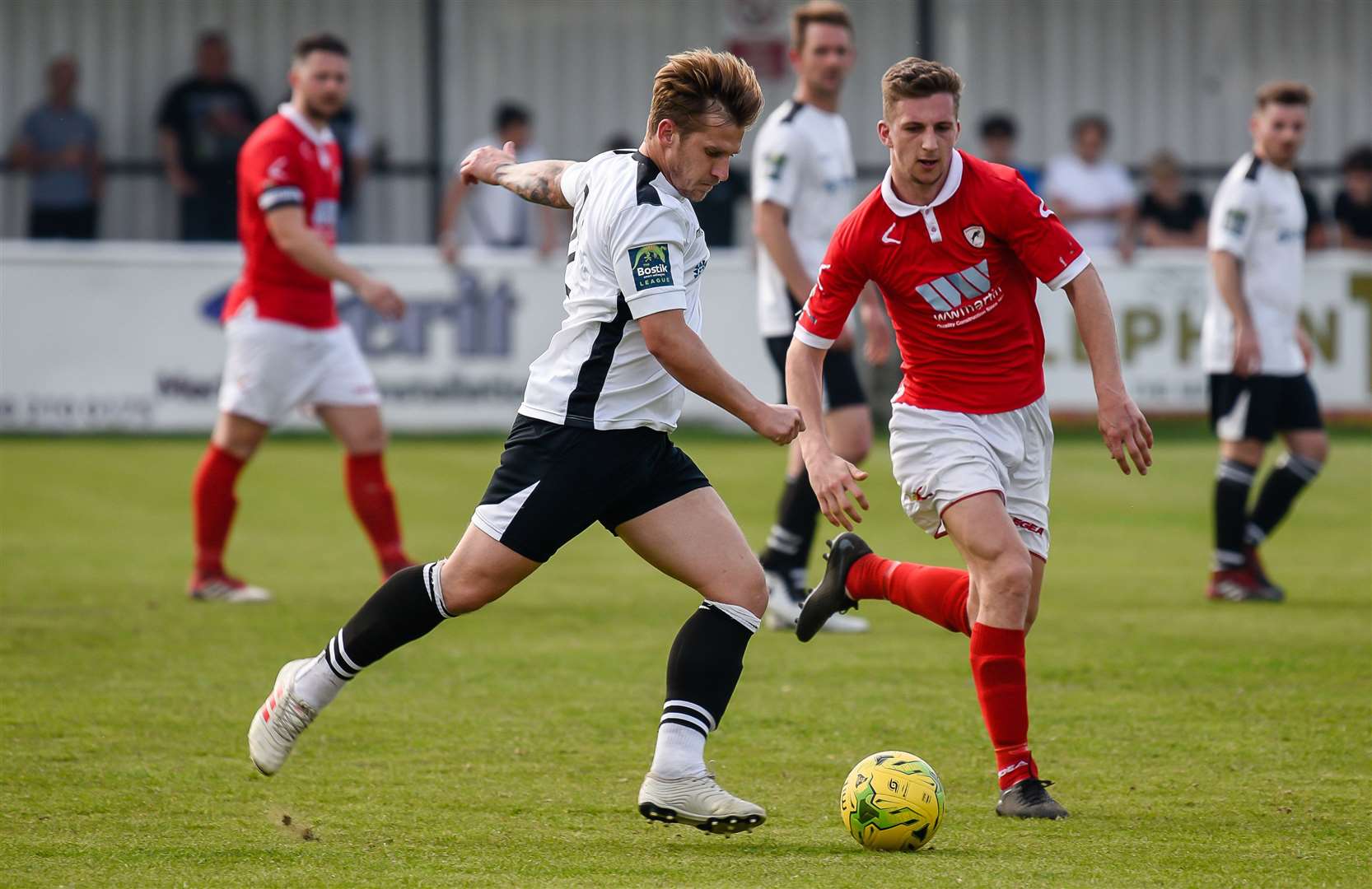 Danny Walder looks to play the ball forward for Faversham Picture: Alan Langley