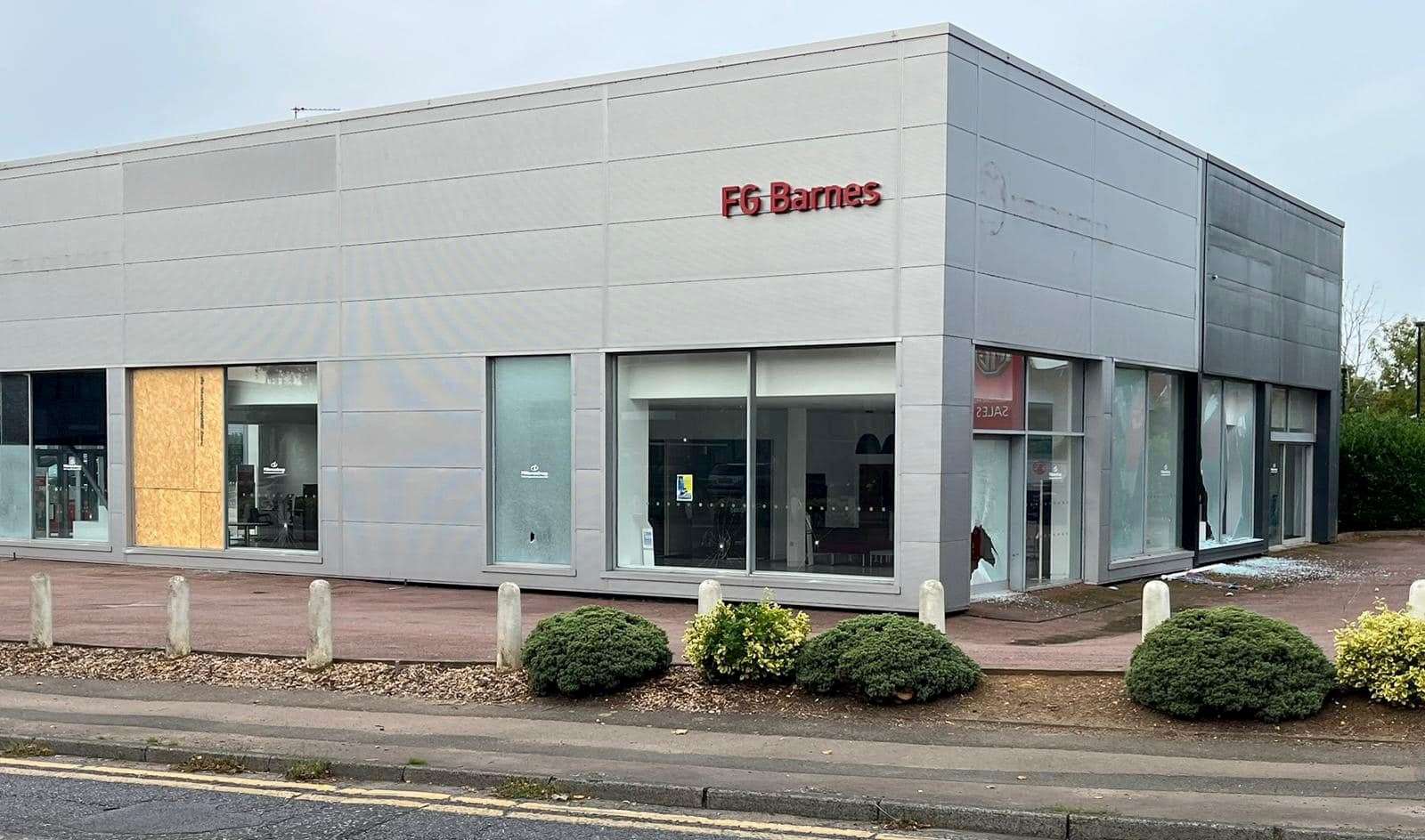 Glass and smashed windows can be seen at the former FG Barnes Vauxhall site in Maidstone. Picture: Sandy Turner