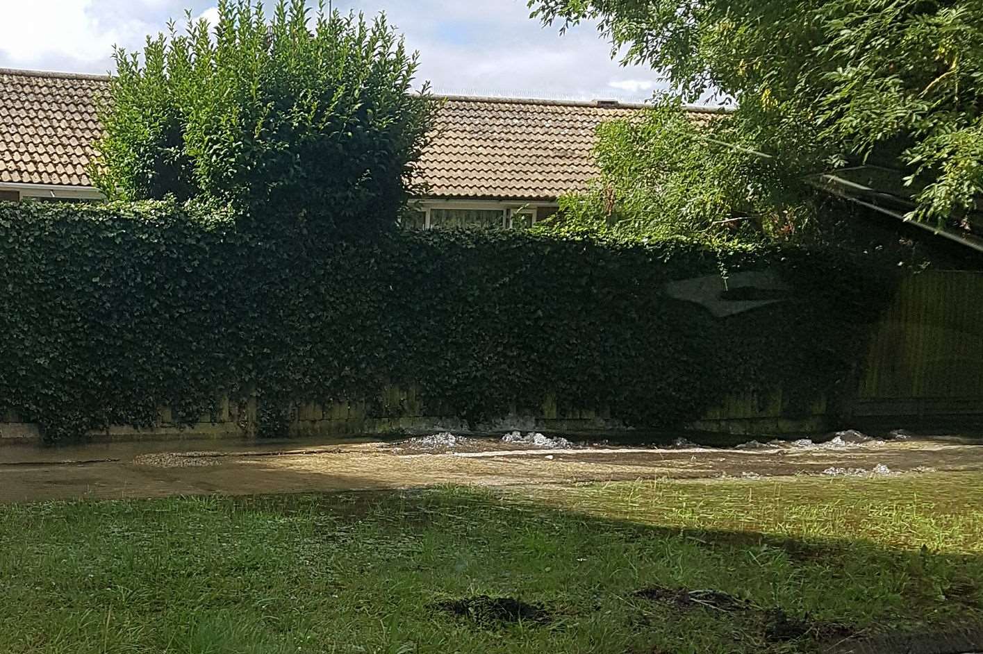 Water pouring along Churchill Avenue. Credit: Michelle Heasman