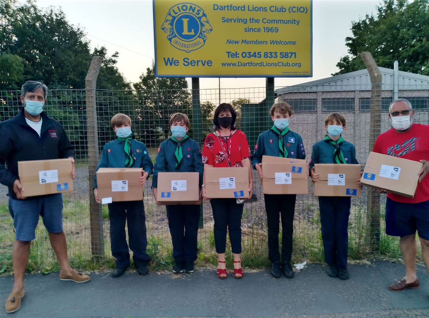 Scouts Oliver, 11, Kieran, 12, Patrick, 13, and Samuel, 14, present 100 face shields to Hi Kent's press officer Debra Jones. Watching on are Dartford Lions president Ragbhir Sandhu and vice-president Avtar Sandhu