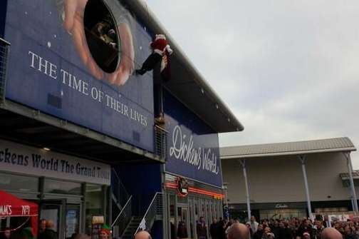 Crowds look on as Santa gets stuck on the side of Dickens World in Chatham Maritime. Picture: CC Tree Surgery Ltd @MedwayTreeCare1