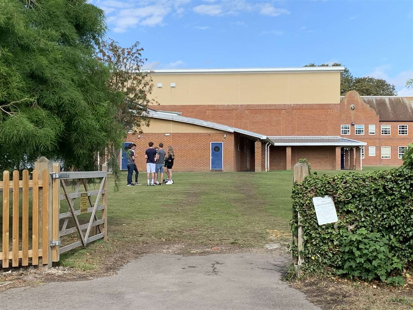 SRMS pupils gather with friends to open their GCSE results on the school field