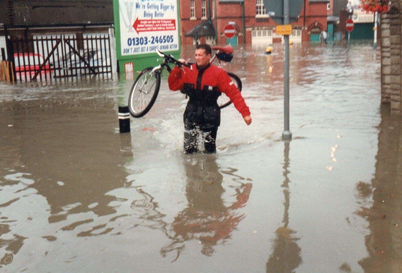 A man wades through flood waters in 1996. Picture: Alan Taylor