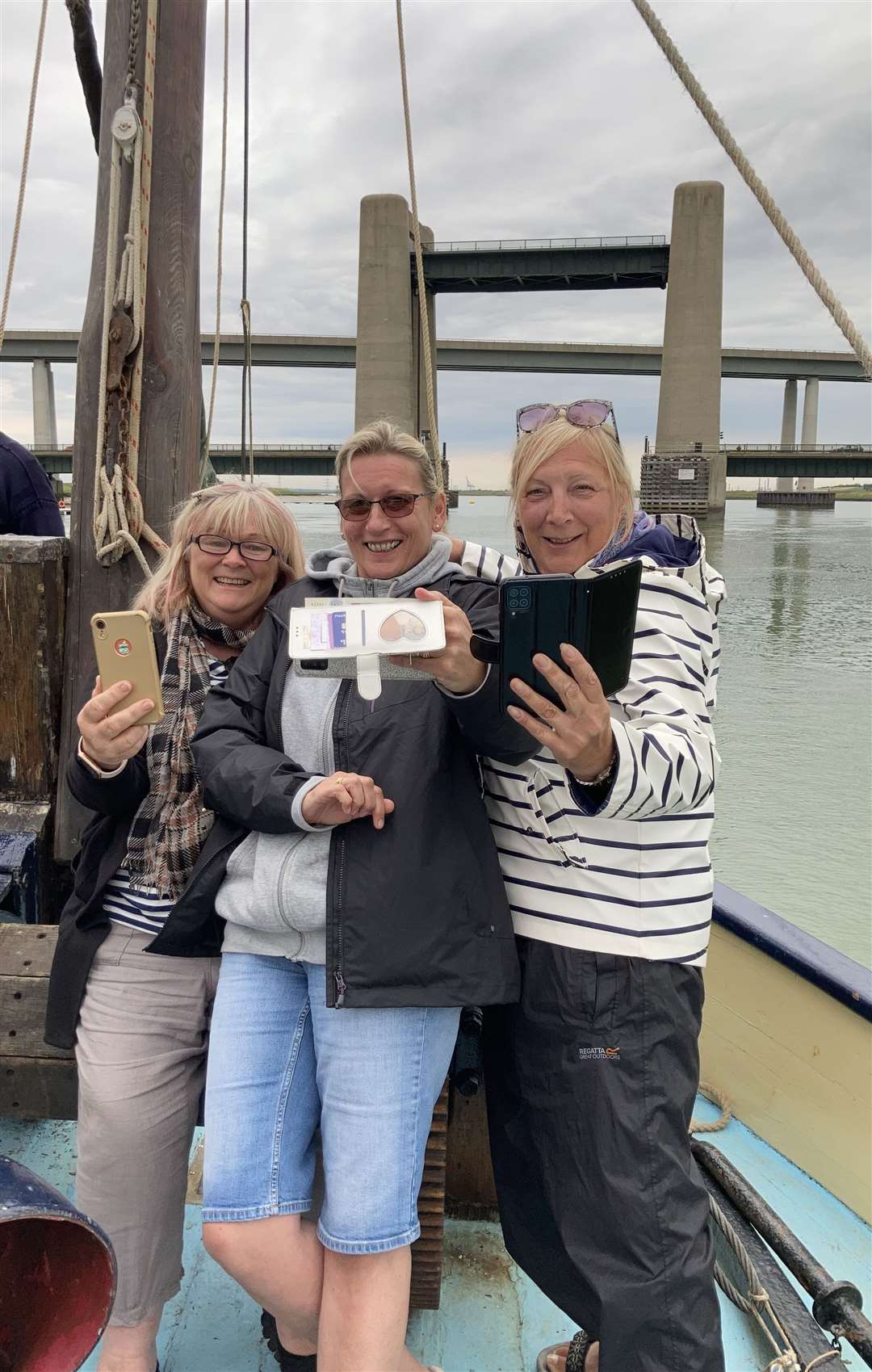 Selfies as the Edith May slips under the Kingsferry Bridge