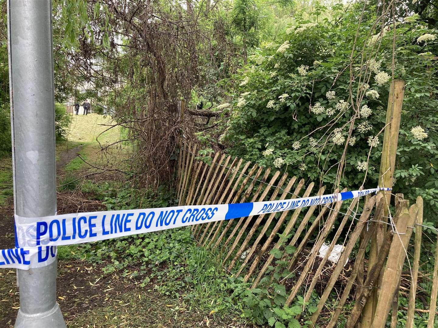 Police tape cordons off the area near where the body was found (Beverley Rouse/PA)