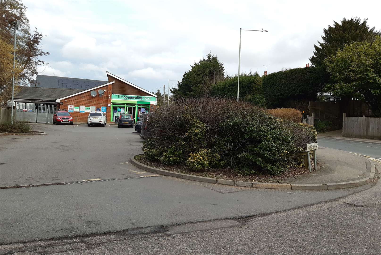 Bosses hope to cut part of the hedge down and extend the pavement at the junction with Tudor Road