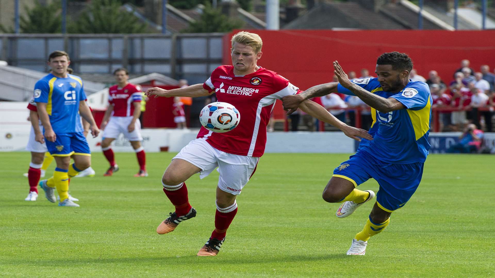 Jordan Parkes battles with Basingstoke's Louie Soares on his Ebbsfleet debut Picture: Andy Payton