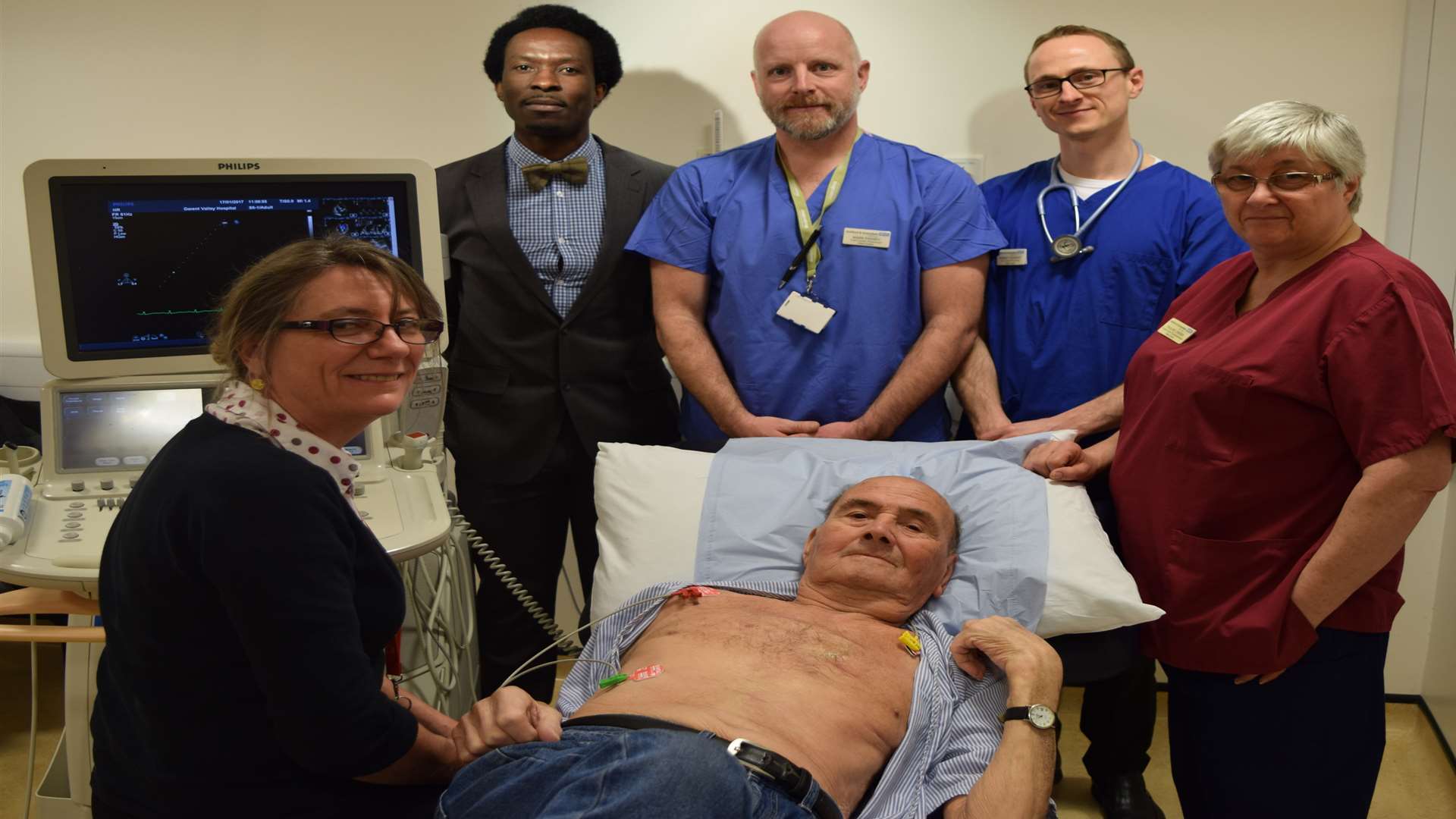 Patient Derek Patterson. with senior staff at Darent Valley Hospital