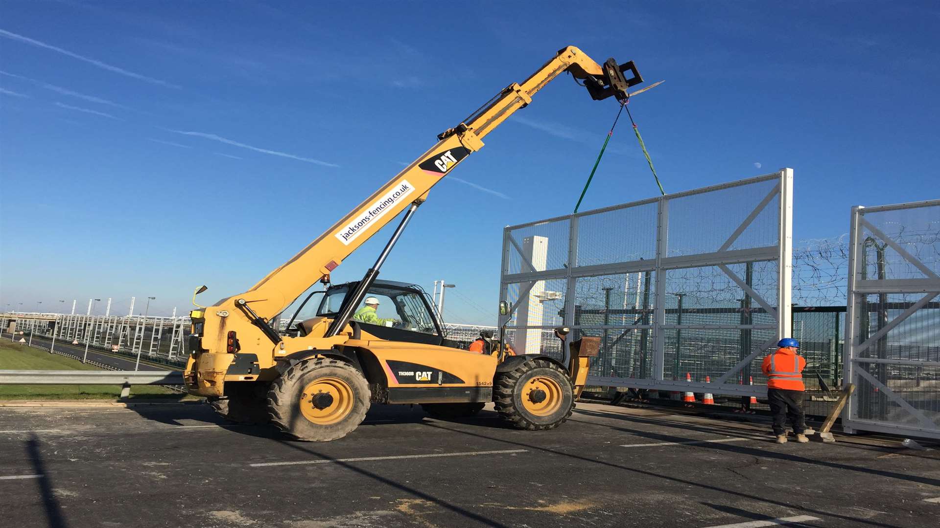 Heavy workload. Lifting the first gate into position.