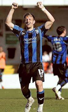 Danny Spiller celebrates Adebayo Akinfenwa's goal