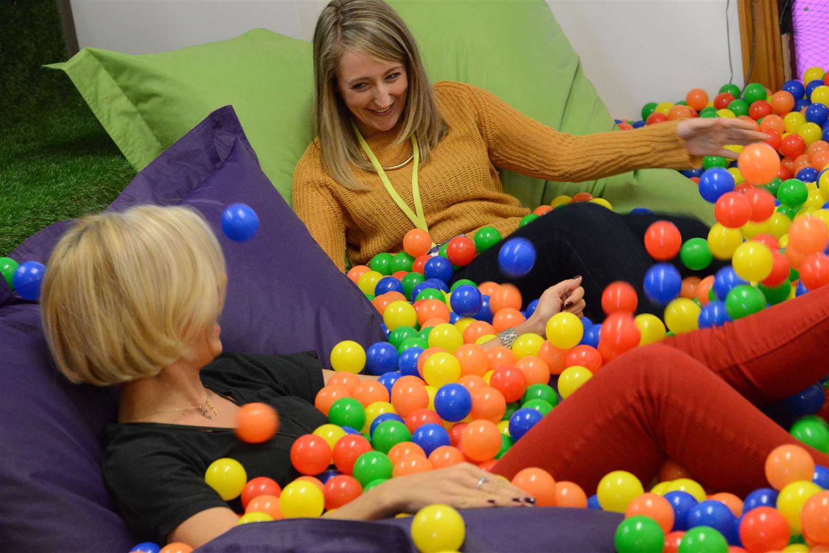 Staff enjoying the ball pool at Sleeping Giant Media