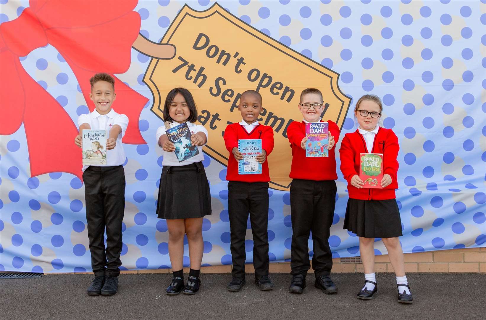 Pupils at the opening of a new library at The John Wallis Church of England Academy in Ashford