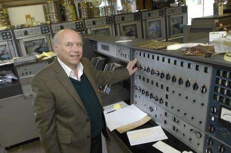 Roger Holmes with Flossy the oldest working digital computer (50 years old this year) at Buss Farm