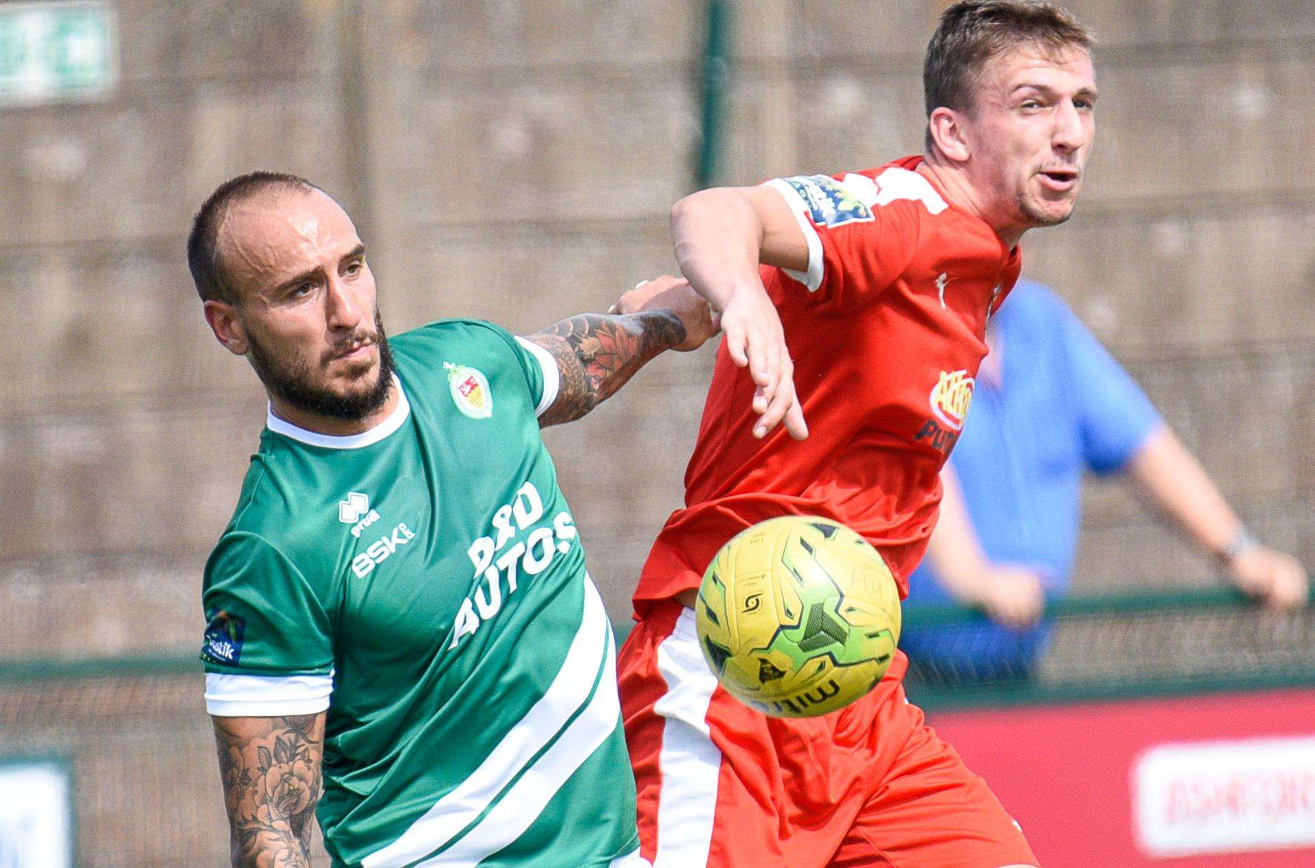 Kane Rowand, right, in action on his debut for Folkestone Invicta at Ashford United Picture: Alan Langley