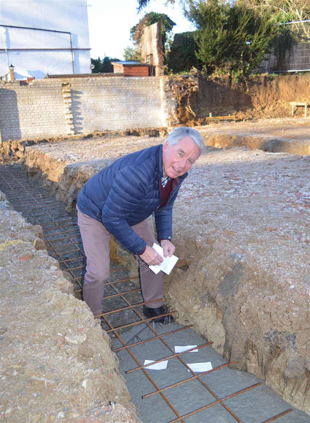 Canon Arthur Houston laying prayers in the foundations