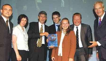 TROPHY WINNERS: Editor Ron Green, third from left, with other members of the KM team, and left, Patrick Breen, from the Royal Mail Group, and Jon Snow, right. Picture courtesy PA/IAN WEST