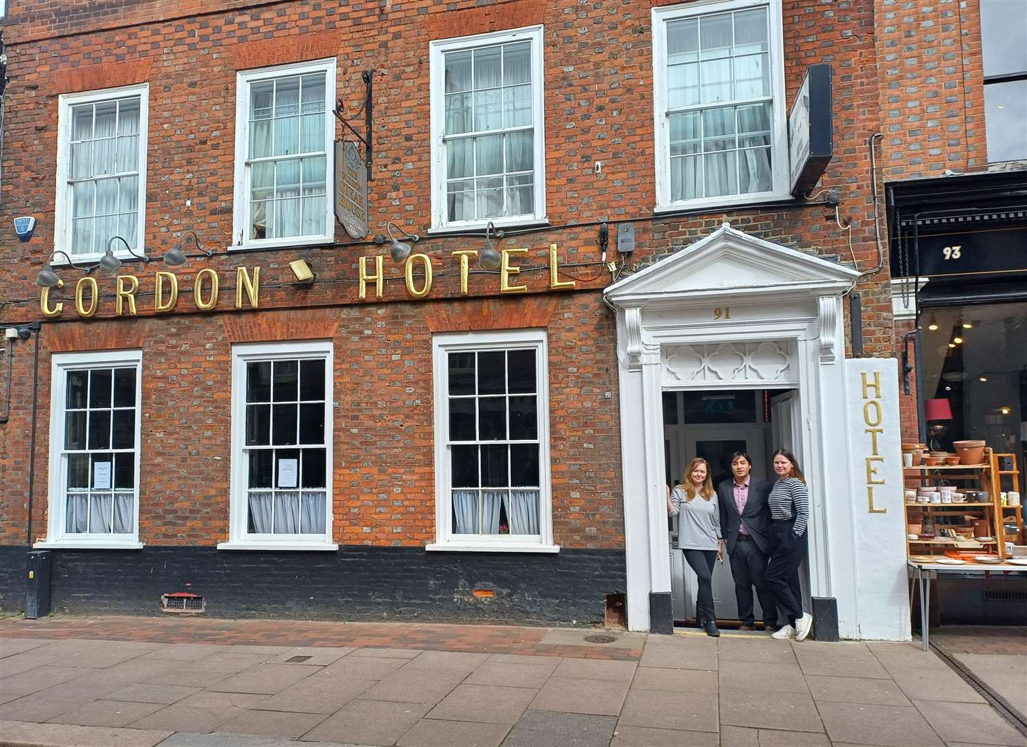 Elena Shome, Monish Shome and Claire Charlton outside the Gordon House Hotel