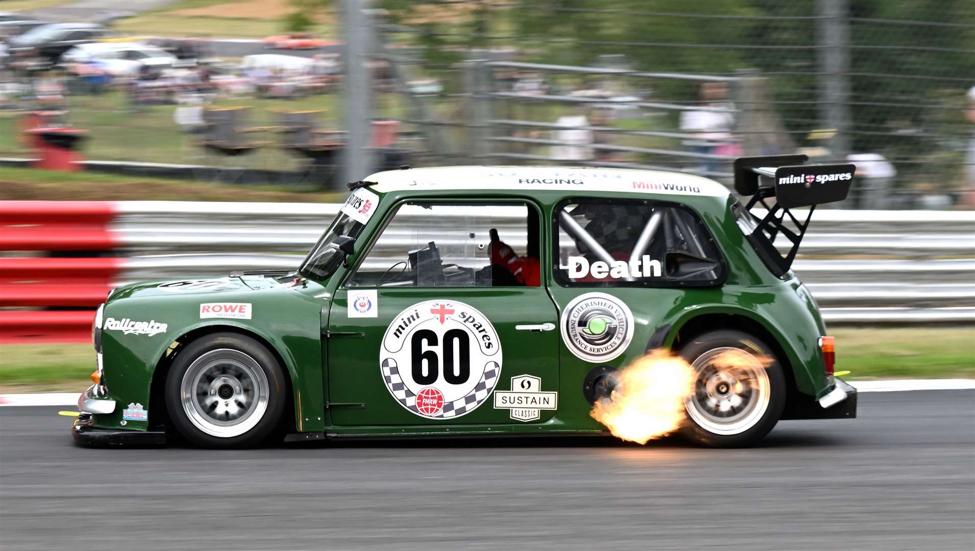 Harvey Death spits flame on his way to winning the two Fastest Mini in the World races in his Mini Cooper S V8. Brookland-based Mini favourite Bill Richards withdrew from the event after gearbox failure in testing. Picture: Simon Hildrew