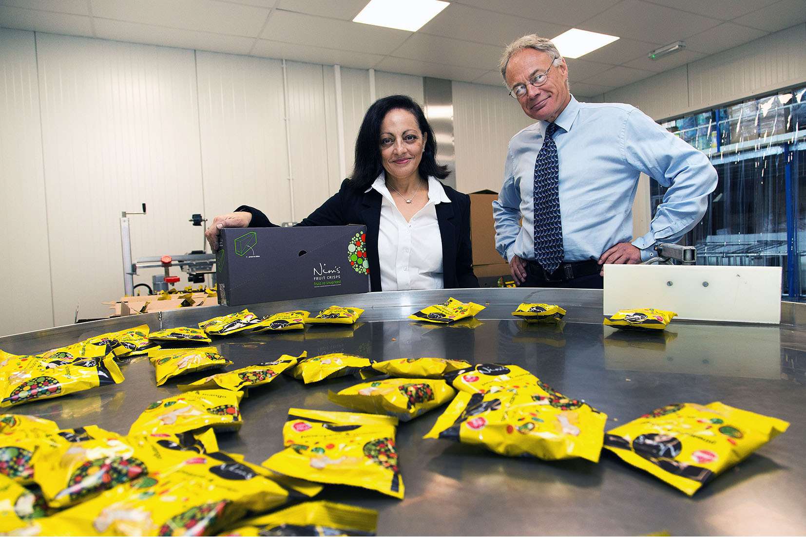 Nimisha Raja of Nim's Fruit Crisps with Ian Pateman of the Business Growth Service