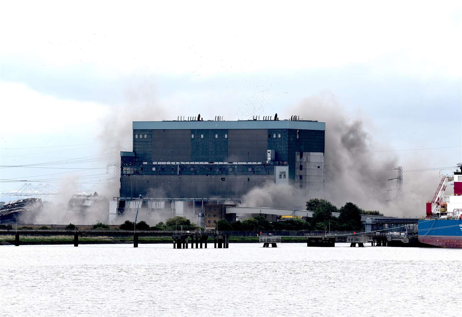 Smoke surrounded the building after the units hit the ground. Picture: Fraser Gray