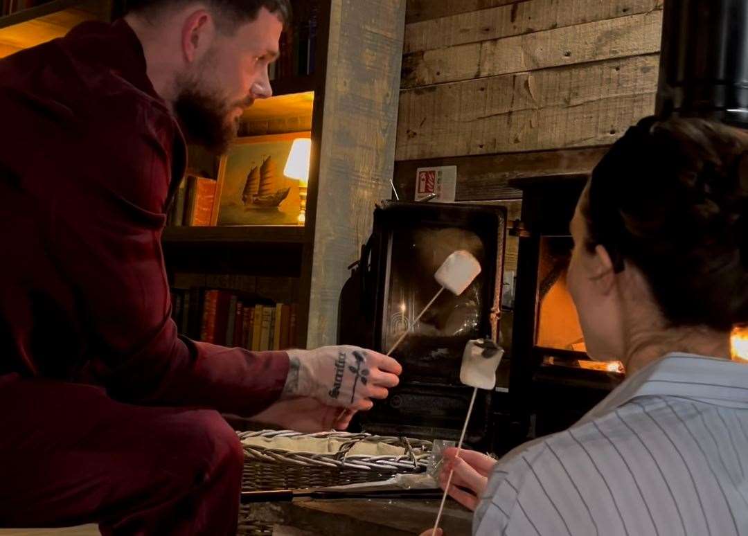 The couple toasted marshmallows during their stay at Tiger Lodge. Picture: Megan McKenna/Instagram