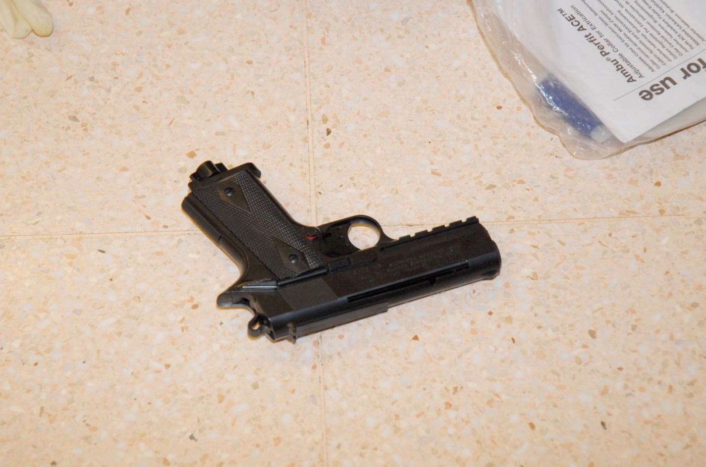 The gun on the floor of Morrison's