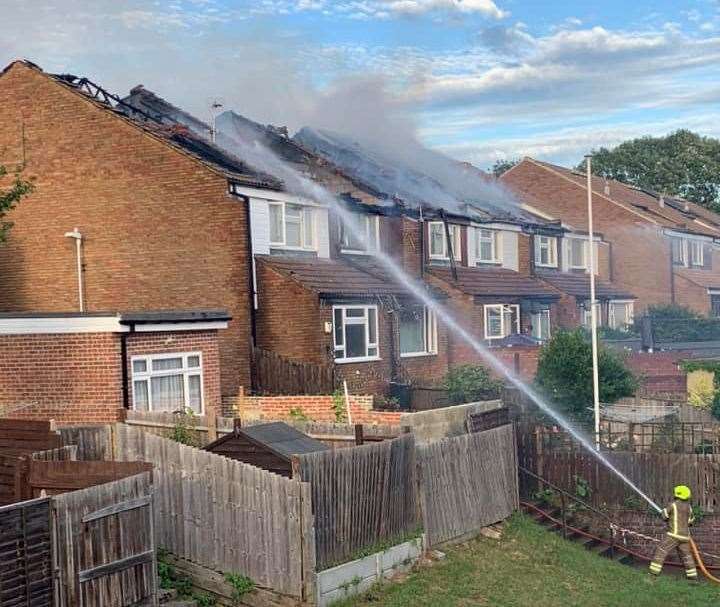 Firefighters tackling the flames in Rose Street, Northfleet. Picture: Alex Helen Reid