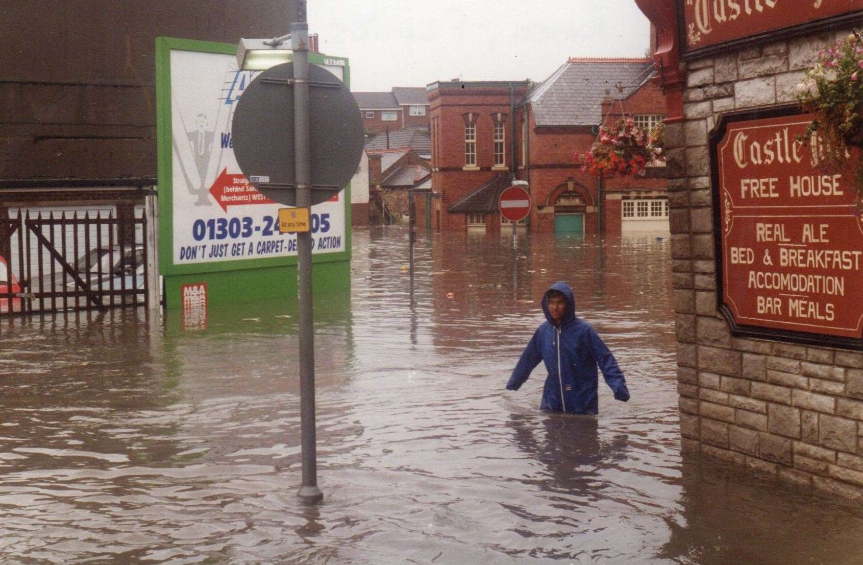 A pedestrian wades through waist-high flood waters in Folkestone in 1996. Picture: Alan Taylor