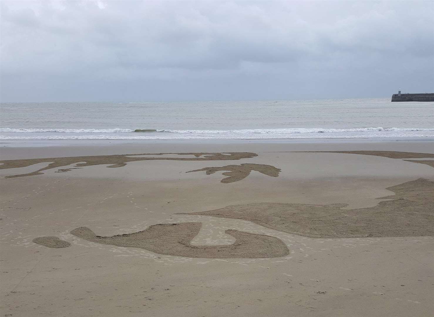 Wilfred Owen's portrait on the beach at Folkestone