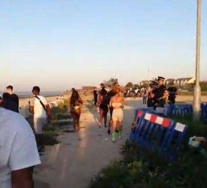 Police were in attendance as a large crowd of people gathered on Leysdown beach