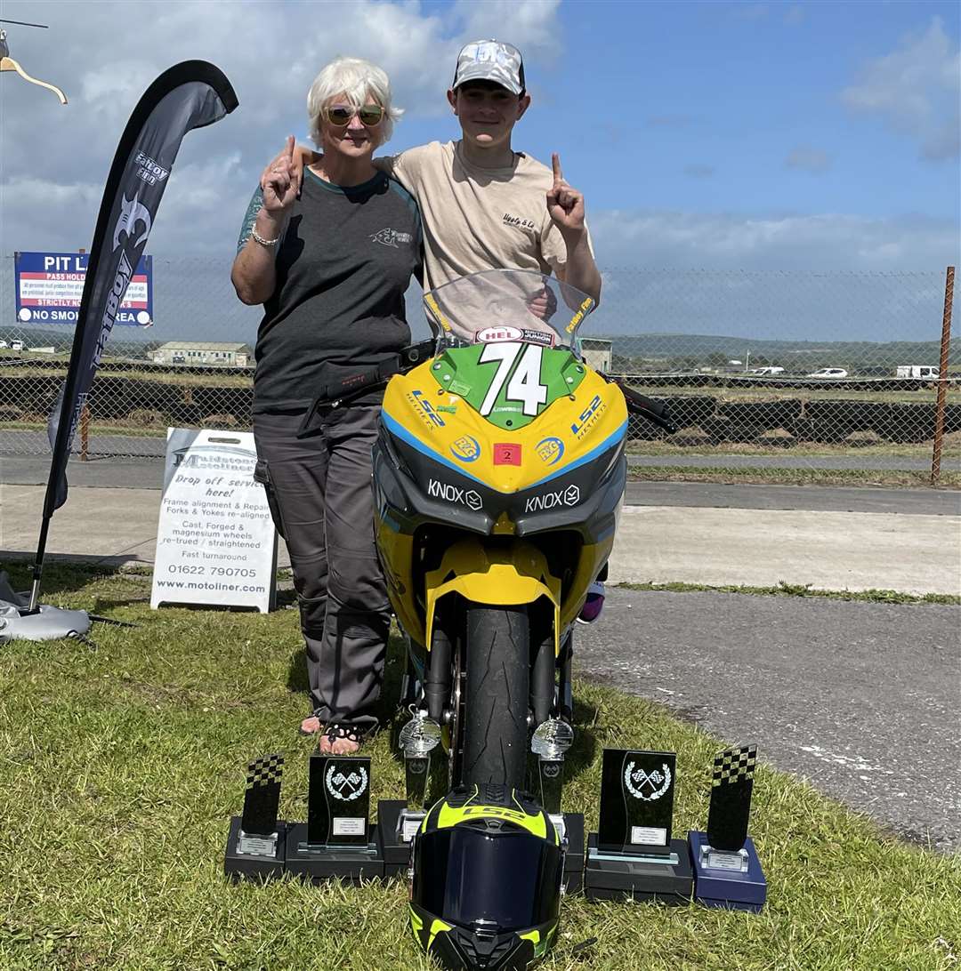 Finn Smart-Weeden and his mum, Georgia, with his bike and the weekend trophy haul. Picture: Elaine Moody