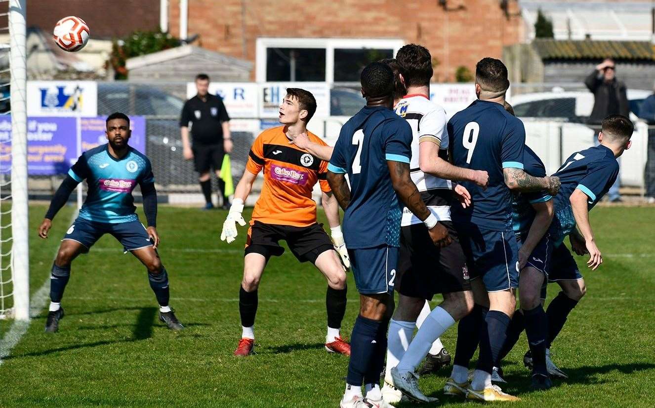 Punjab keeper Harrison Firth looks helplessly on as Billy Munday, sandwich between two defenders, heads Deal in front during their 2-2 draw with Punjab on Saturday. Picture: Tony Flashman