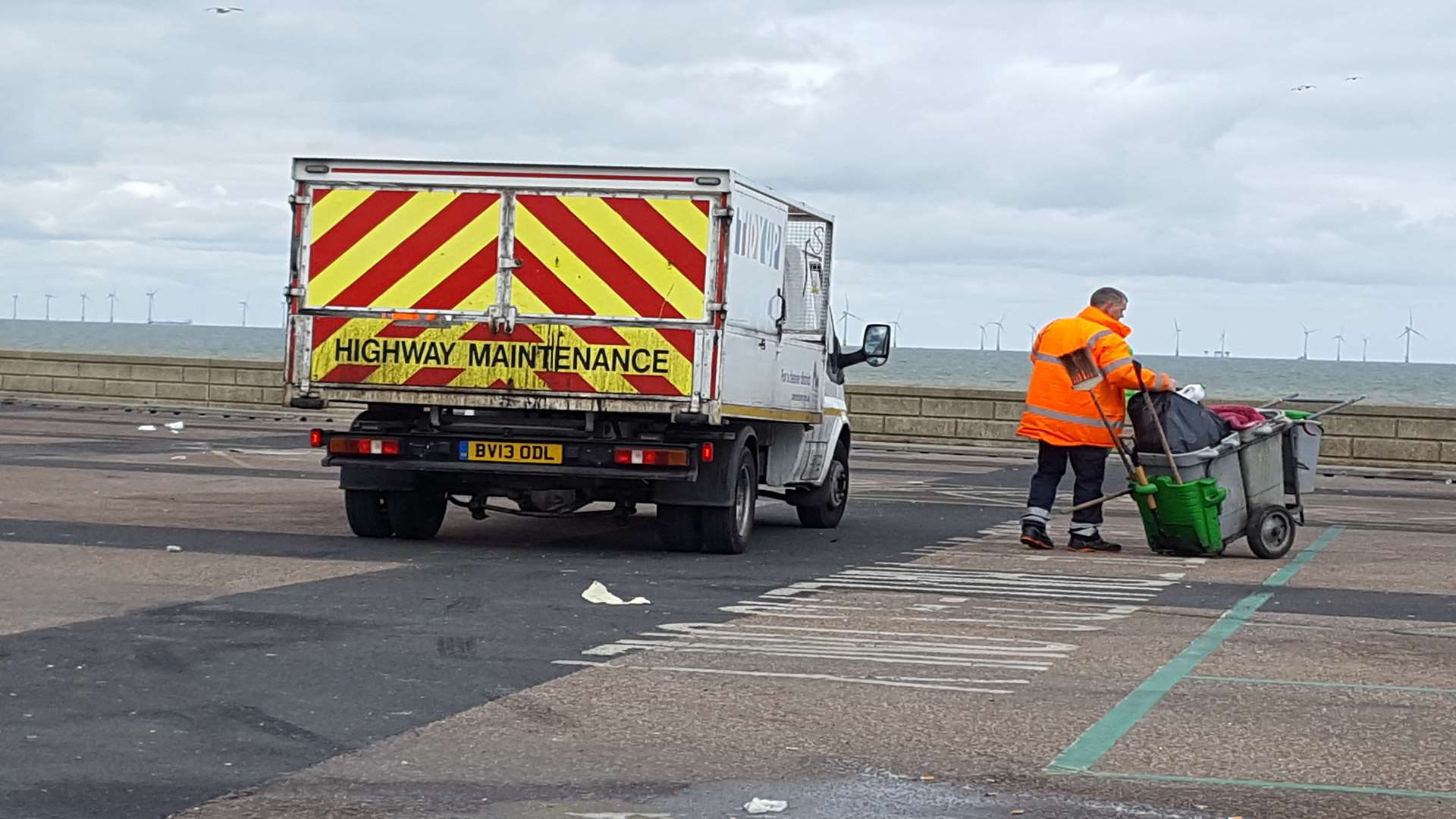 A Serco worker clears up the mess in the Neptune car park