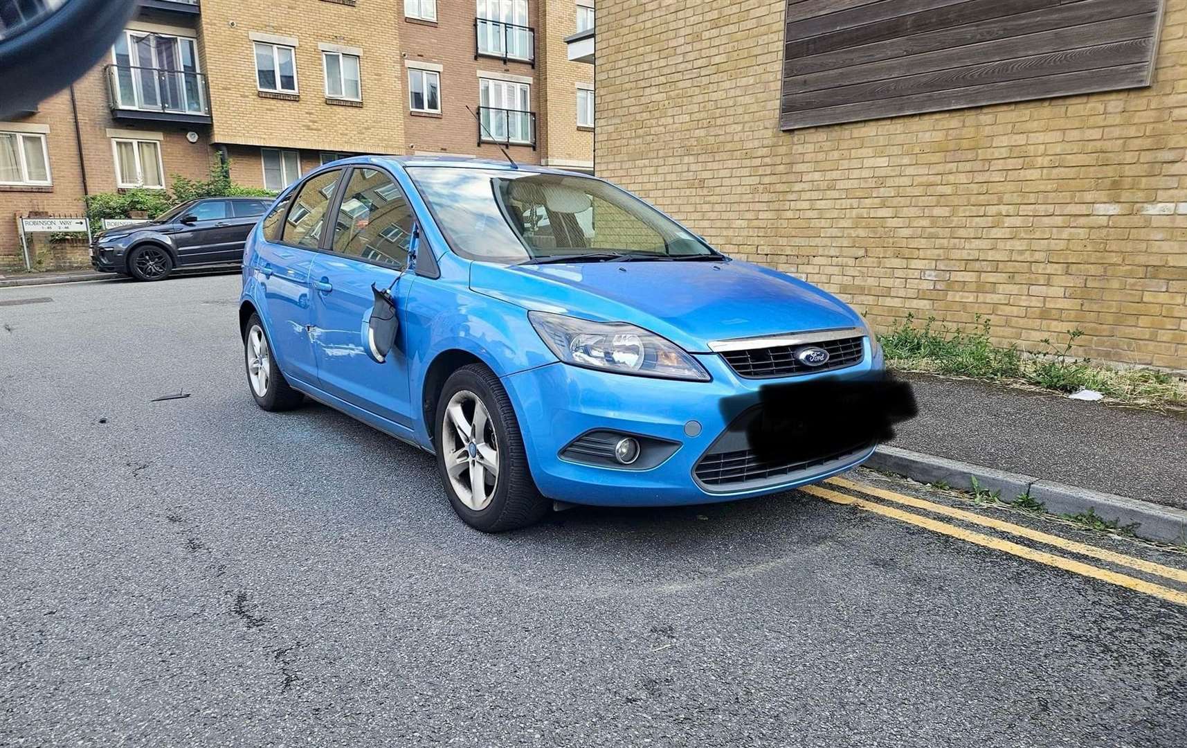 This parked car was damaged in Phoenix Parc, Northfleet