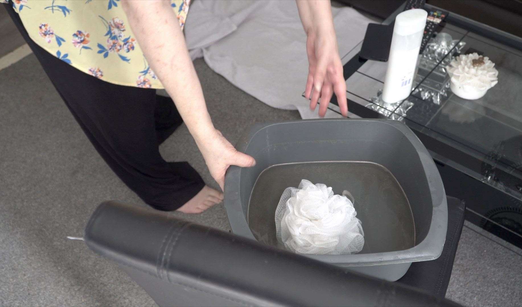 The bucket Ms Roberts has been forced to use to wash herself every day