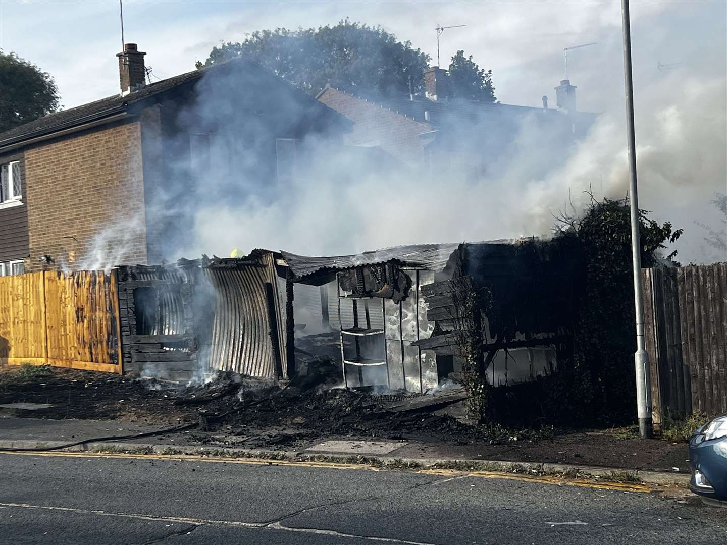 A fence has been destroyed by flames. Picture: Steve Salter