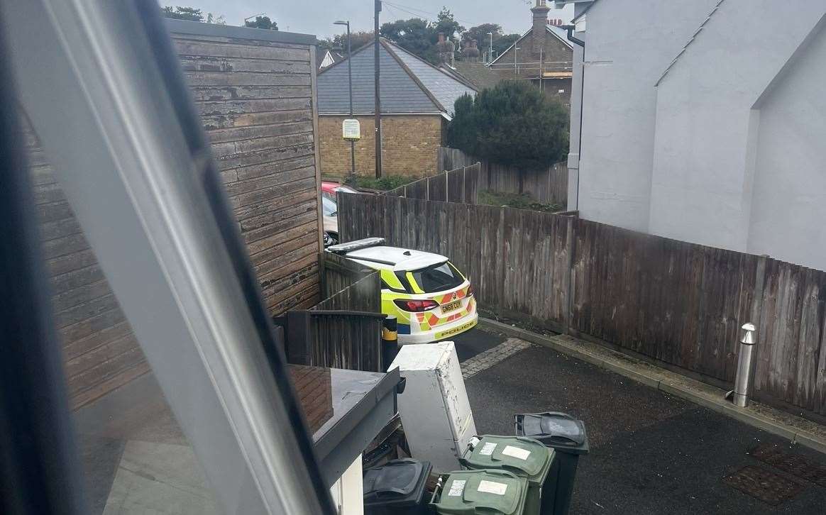 The police car parked in a private bay