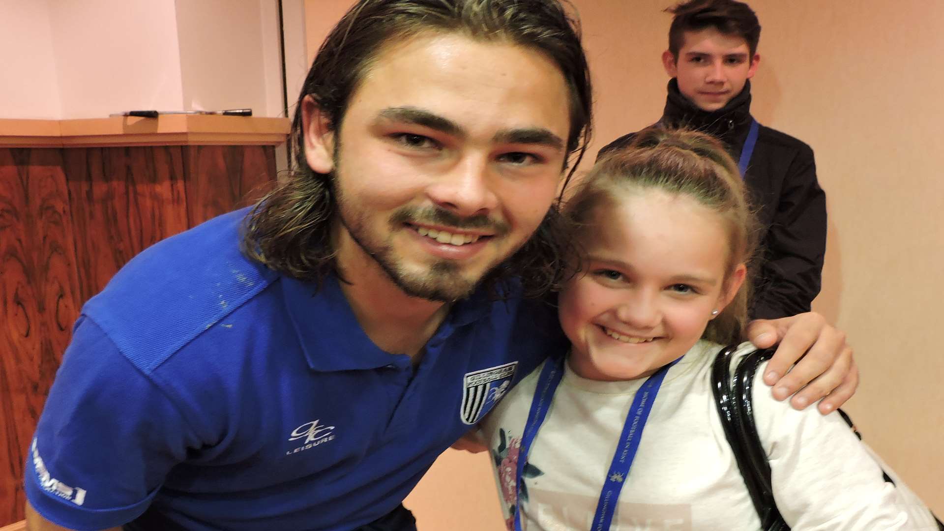 Charlie Nash was Gillingham's 12th man. Bradley Dack with Maddie Nash