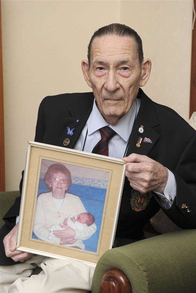 Maurice Bernard with a picture of his late wife, Dora