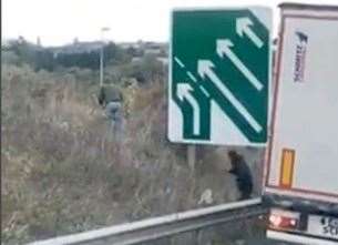 Footage captures the moment a group of men are seen jumping from a lorry at the side of the M25 and A2 junction at Bean