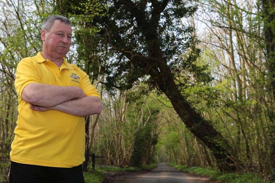 Play bus owner Norman Laverock and the uprooted tree in Detling