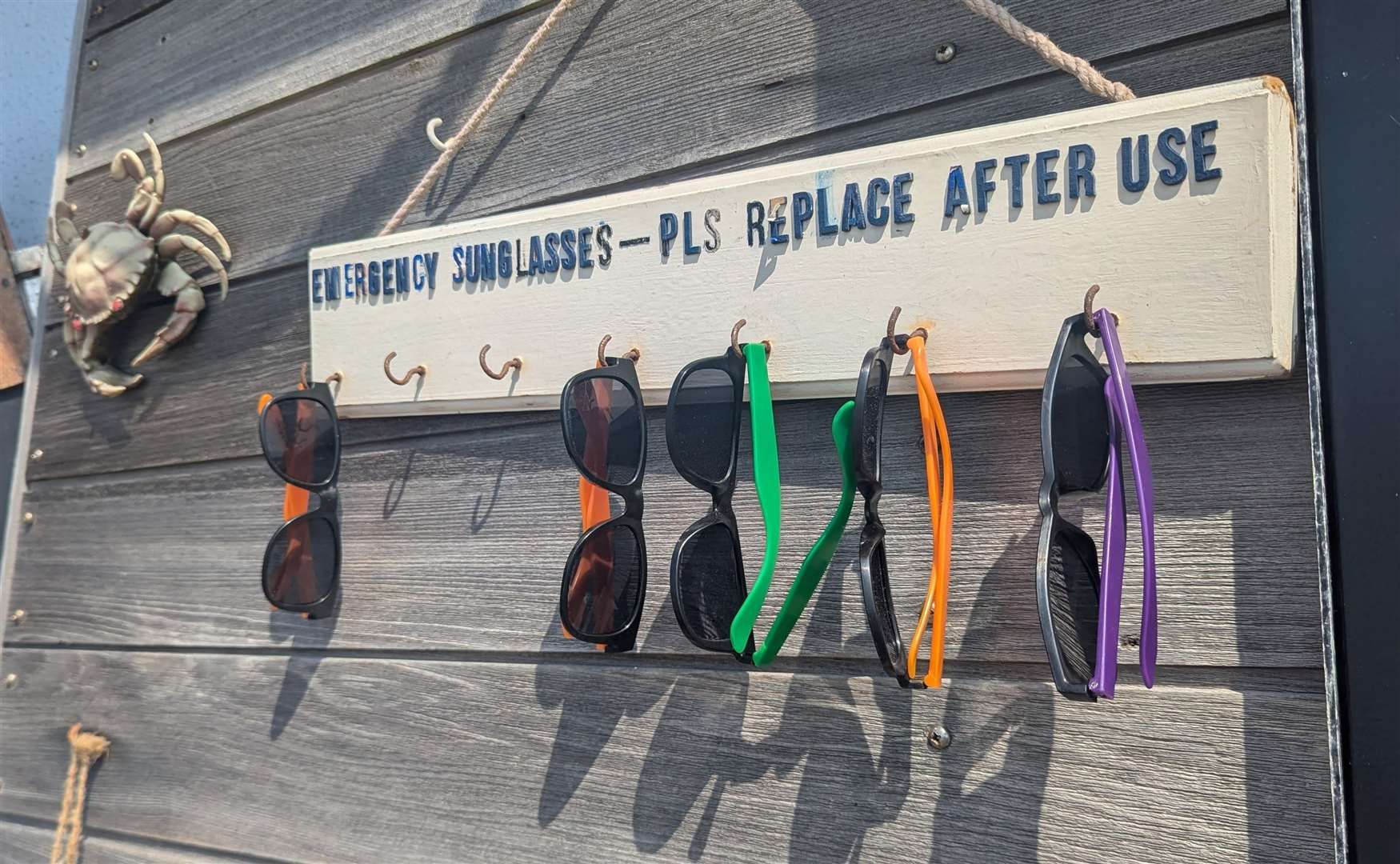 A handy rack of emergency sunglasses at The Boat House cafe in Sandgate