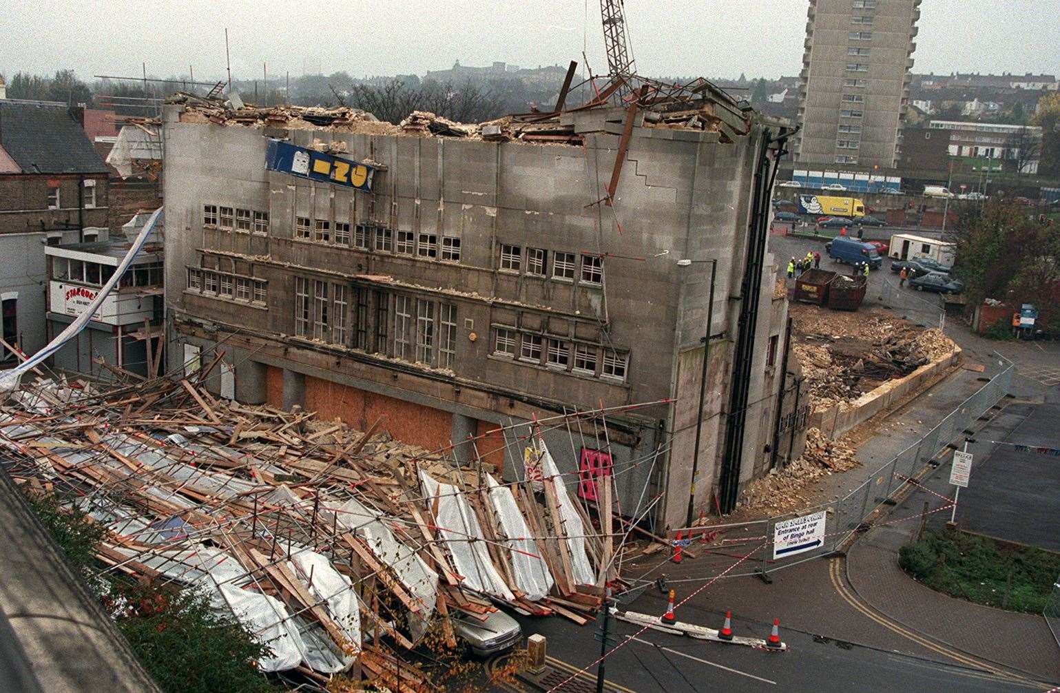 An overly forceful blow with the wrecking ball sent the scaffolding crashing to the ground in the High Street crushing parked cars but fortunately nobody was killed