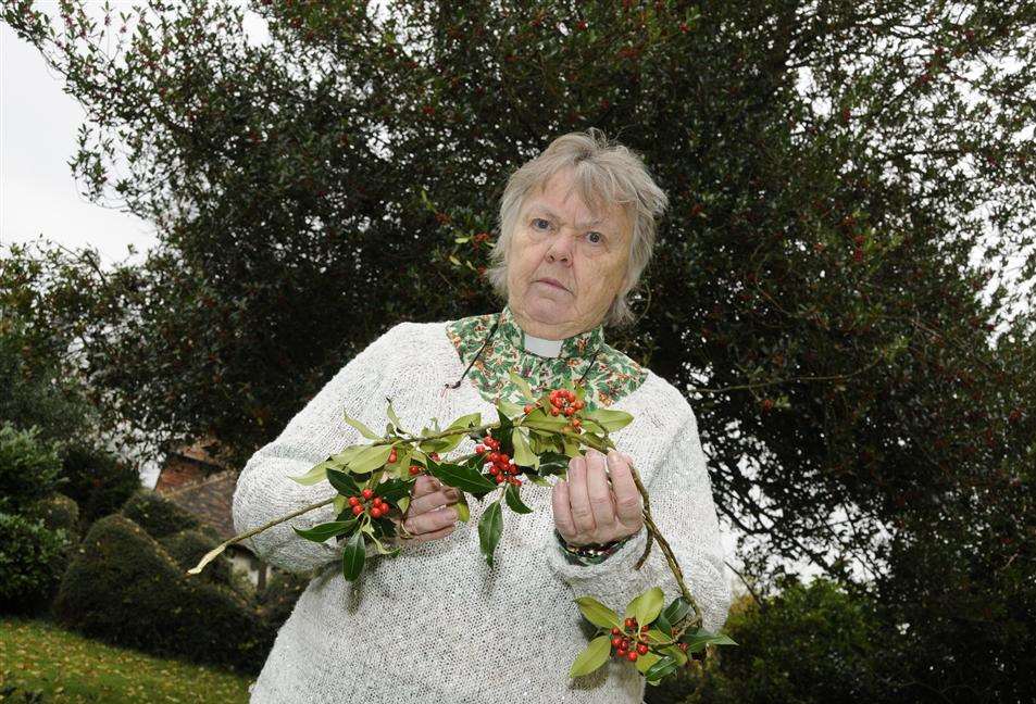 Canon Sheila McLachlan in front of the damaged tree