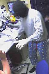 CCTV of the robbery... with the distinctive pyjamas