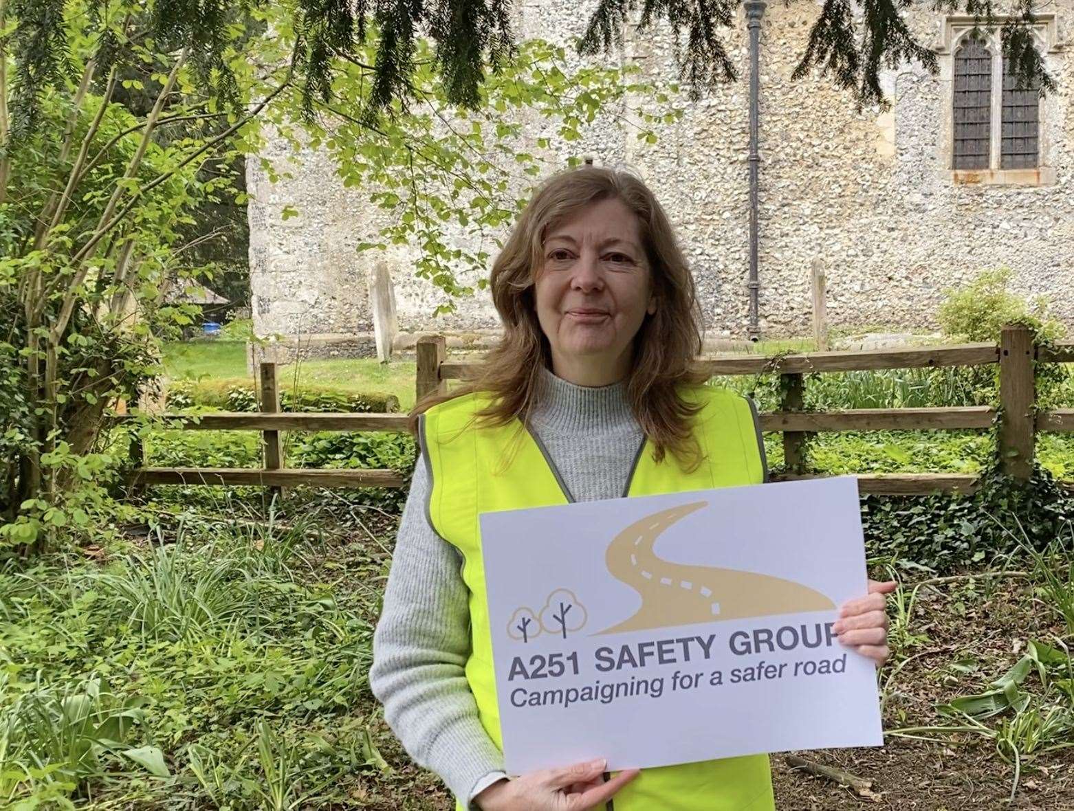 Hazel Bellord holds an A251 Safety Group sign as she calls for lorries to be banned from the road