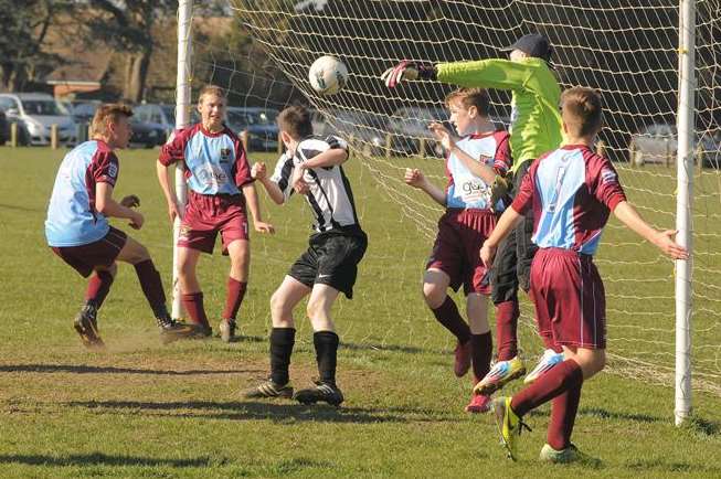 Goalmouth action between Real 60 (black and white) and Wigmore Youth under-15s in the John Leeds quarter-final Picture: Steve Crispe