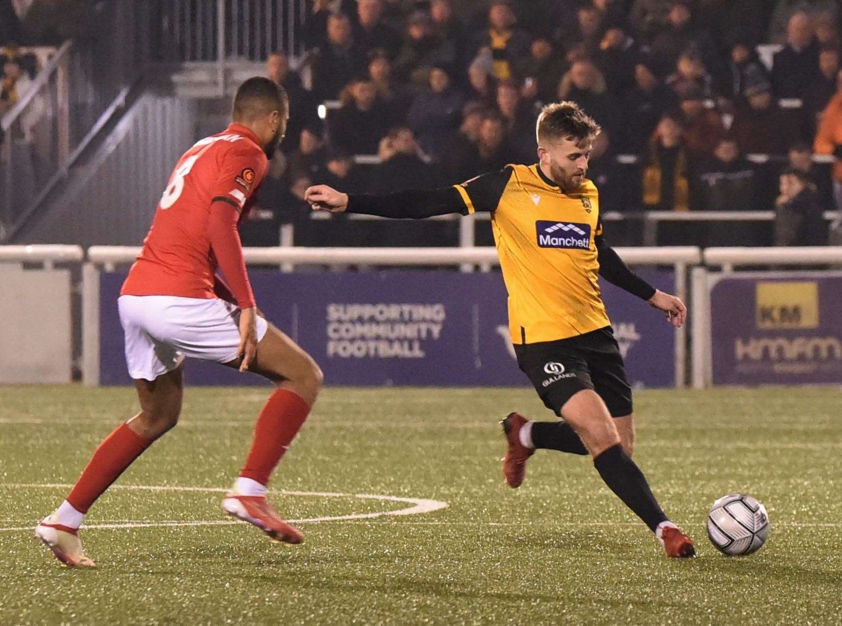 Maidstone midfielder Regan Booty moves away from Ebbsfleet's Christian N'Guessan Picture: Steve Terrell